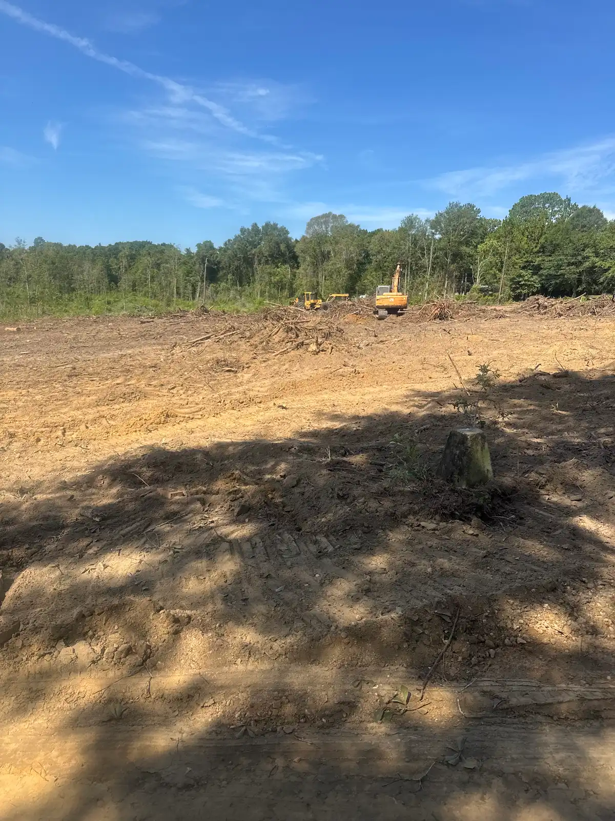 Excavation equipment on cleared acreage