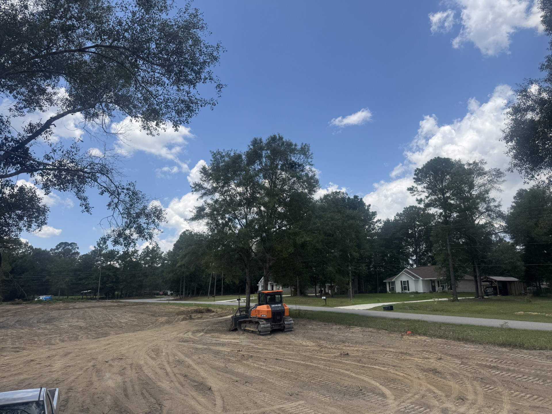 Equipment working on a cleared property